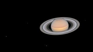 This Hubble Space Telescope image of Saturn, captured in June 2018, shows six of the planet’s 145 known moons. The visible satellites are (from left to right) Dione, Enceladus, Tethys, Janus, Epimetheus and Mimas.
